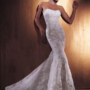 Classic strapless sheath Demetrios 900 IIissa gown in white beaded lace.